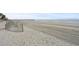 Expansive sandy beach with weathered wooden fence at 107 S Ocean Blvd. # 2106, Myrtle Beach, SC 29577