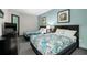 Comfortable bedroom features two beds, artwork, and a sleek black dresser with a TV at 107 S Ocean Blvd. # 2106, Myrtle Beach, SC 29577