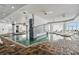 Inviting indoor pool area with brick flooring and lounge chairs, providing a relaxing atmosphere at 107 S Ocean Blvd. # 2106, Myrtle Beach, SC 29577