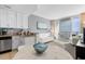 Cozy living area with a modern kitchen, dining table, and ocean views, designed for comfortable living at 107 S Ocean Blvd. # 2106, Myrtle Beach, SC 29577