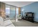 Comfortable living room with direct access to a private balcony offering views of the ocean at 107 S Ocean Blvd. # 2106, Myrtle Beach, SC 29577
