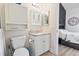 Bright bathroom featuring a vanity, mirror, toilet, and stylish decor at 110 South Shore Blvd. # 302, Longs, SC 29568