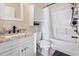 Bathroom with vanity, toilet, framed mirror, and tub shower combo at 110 South Shore Blvd. # 302, Longs, SC 29568