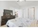 Bedroom with light-filled view and a wooden dresser at 110 South Shore Blvd. # 302, Longs, SC 29568