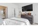 Cozy bedroom with a flat screen TV and a door leading to the bathroom at 110 South Shore Blvd. # 302, Longs, SC 29568