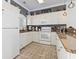 Well-lit kitchen with white cabinetry, modern appliances, and granite countertops offering style and functionality at 110 South Shore Blvd. # 302, Longs, SC 29568