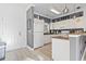 Kitchen features white cabinets, countertops, and modern appliances at 110 South Shore Blvd. # 302, Longs, SC 29568