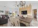 Open-concept living room and dining area with access to outdoor patio, bathed in natural light with high ceilings at 110 South Shore Blvd. # 302, Longs, SC 29568