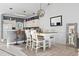 Inviting living space featuring a modern kitchen with bar seating, a dining area, and a comfortable living room at 110 South Shore Blvd. # 302, Longs, SC 29568