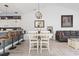 Open-concept living space with kitchen bar, dining area, and cozy living room, perfect for entertaining at 110 South Shore Blvd. # 302, Longs, SC 29568