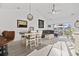 Bright living room with dining area and access to an outdoor balcony at 110 South Shore Blvd. # 302, Longs, SC 29568