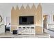 Living room with a custom wood panel wall and built in cabinets with TV at 110 South Shore Blvd. # 302, Longs, SC 29568