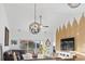 Open-concept living and dining area boasts high ceilings, a ceiling fan, and seamless indoor-outdoor flow at 110 South Shore Blvd. # 302, Longs, SC 29568