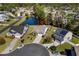 Aerial view of a home nestled in a community near a pond with mature trees and landscaping at 1205 Woodruff Ct., Conway, SC 29526