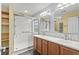 Bathroom featuring a double vanity with wood cabinets, and a glass enclosed tile shower at 1205 Woodruff Ct., Conway, SC 29526