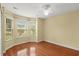 Bright bedroom with hardwood flooring, bay window and ceiling fan, providing ample natural light at 1205 Woodruff Ct., Conway, SC 29526