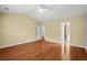 Bright bedroom with gleaming hardwood floors and open doorway, creating a sense of spaciousness at 1205 Woodruff Ct., Conway, SC 29526