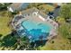 Aerial shot of a sparkling community pool, surrounded by manicured landscaping and seating areas at 1205 Woodruff Ct., Conway, SC 29526