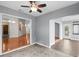 Open dining area with a ceiling fan, view of hardwood floors, and a large doorway at 1205 Woodruff Ct., Conway, SC 29526