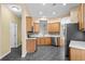 Spacious kitchen featuring wood cabinets, stainless appliances, and tile flooring at 1205 Woodruff Ct., Conway, SC 29526