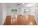 Spacious living room with hardwood floors, neutral paint, and ample natural light at 1205 Woodruff Ct., Conway, SC 29526