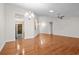 Spacious open-concept living room featuring hardwood floors, ceiling fan, and natural light at 1205 Woodruff Ct., Conway, SC 29526