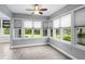 Cozy sunroom featuring neutral walls, tiled floor, and many windows at 1205 Woodruff Ct., Conway, SC 29526