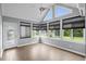 Bright sunroom with large windows, neutral walls, and stylish flooring at 1205 Woodruff Ct., Conway, SC 29526
