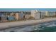 Aerial view of a sprawling beach featuring resort and condo buildings at 1207 S Ocean Blvd. # 20206, Myrtle Beach, SC 29577