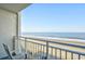 Relax on the balcony with stunning ocean views and comfortable seating at 1207 S Ocean Blvd. # 20206, Myrtle Beach, SC 29577