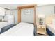 Comfortable bedroom with pull down murphy bed, side table and mini kitchenette at 1207 S Ocean Blvd. # 20206, Myrtle Beach, SC 29577