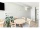 Cozy dining area with a round table, four chairs, and hardwood floors at 1207 S Ocean Blvd. # 20206, Myrtle Beach, SC 29577