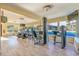 Well-equipped gym featuring modern equipment and large windows at 1207 S Ocean Blvd. # 20206, Myrtle Beach, SC 29577