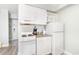 Efficient kitchen with white appliances, compact design, and essential amenities at 1207 S Ocean Blvd. # 20206, Myrtle Beach, SC 29577