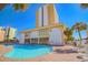 Outdoor pool area with lounge chairs and well-maintained landscaping for relaxation at 1207 S Ocean Blvd. # 20206, Myrtle Beach, SC 29577