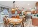 Eat-in kitchen featuring a dining area, stainless steel appliances, and a granite-topped island with pendant lighting at 1888 Singing Pines Dr., Conway, SC 29527