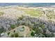 Aerial view showcasing home's pool and extensive wooded surroundings at 1993 Meadowood Ln., Longs, SC 29568