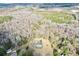 An aerial shot showcases the home and surrounding mature woodland at 1993 Meadowood Ln., Longs, SC 29568