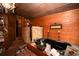 Relaxing bathroom featuring a jacuzzi tub with stone accents and wood paneling for a rustic aesthetic at 1993 Meadowood Ln., Longs, SC 29568