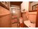 Compact bathroom showcases a shower, toilet, and sink with a decorative mirror and woven basket accents at 1993 Meadowood Ln., Longs, SC 29568