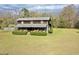 Beautiful front of a home featuring a relaxing and inviting porch at 1993 Meadowood Ln., Longs, SC 29568
