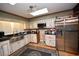 Well-lit kitchen featuring stainless steel appliances, skylight, and wooden accents at 1993 Meadowood Ln., Longs, SC 29568