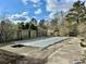 Backyard swimming pool with a partial pool cover surrounded by a concrete deck, with a wooden fence at 1993 Meadowood Ln., Longs, SC 29568