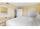 Bedroom featuring a queen bed, dresser, mirror, and adjoining bathroom at 2000 N Ocean Blvd. # 1601, Myrtle Beach, SC 29577
