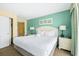 Comfortable bedroom with a queen bed, soft lighting, and access to a well-lit bathroom at 2000 N Ocean Blvd. # 1601, Myrtle Beach, SC 29577