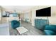 Comfortable living area featuring modern decor, a flat-screen TV, and a partial kitchen view at 2000 N Ocean Blvd. # 1601, Myrtle Beach, SC 29577