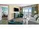 Serene living room with ocean views, a TV, and a glimpse into a cozy bedroom at 2000 N Ocean Blvd. # 1601, Myrtle Beach, SC 29577
