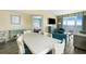 Bright living room with dining area, partial bedroom view, and a balcony with ocean views at 2000 N Ocean Blvd. # 1601, Myrtle Beach, SC 29577