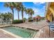 Inviting outdoor pool area with palm trees, brick pavers, and a fun splash fountain at 2000 N Ocean Blvd. # 1601, Myrtle Beach, SC 29577