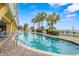 Stunning outdoor pool with inviting clear water, palm trees, and comfortable loungers at 2000 N Ocean Blvd. # 1601, Myrtle Beach, SC 29577